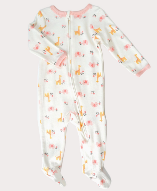 The Lollipop Dreams Pink Safari Zip Footie is a white baby onesie with pink trim, a front zipper, and a playful print of yellow giraffes, pink elephants, and small flowers.