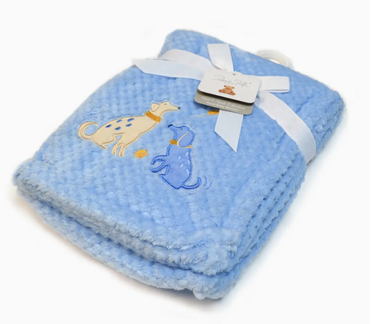 The Lollipop Dreams Puppy Pals Snuggle Blanket is a soft, light blue baby blanket with embroidered playful yellow and blue dogs and a tiny yellow ball, folded and tied with a white ribbon.