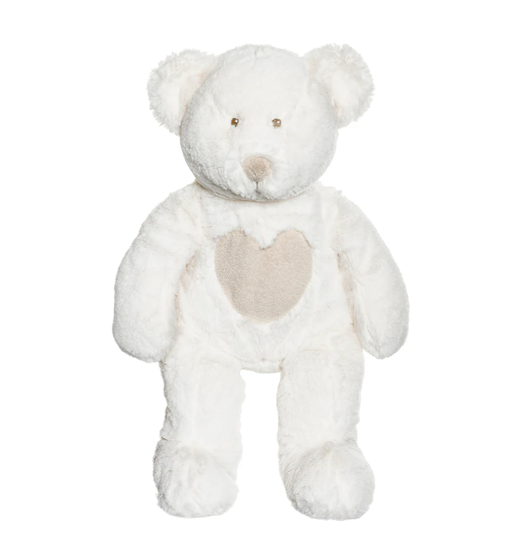 The Triaction Large Teddy Cream Bear sits upright with a beige heart patch on its chest, featuring small, light eyes and nose for a gentle, cuddly look.