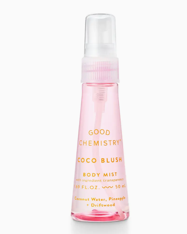 A pink spray bottle labeled Good Chemistry Coco Blush Mini Body Mist, a coconut body mist with notes of coconut water, pineapple, and driftwood for a tropical scent. 1.69 fl oz (50 ml).