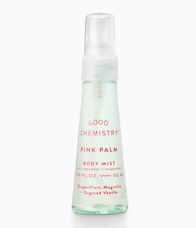 The Good Chemistry Pink Palm Mini Body Mist comes in a clear 50 mL spray bottle with a transparent cap and minimal pink-orange text, featuring notes of dragonfruit, magnolia, and sugared vanilla for a fresh, vibrant vibe.