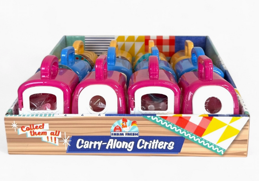 Toy Smith’s Farm Fresh Carry-Along Critters come in a display box with colorful pink, blue, and yellow pet carriers holding cute animal figurines. Each carrier has a handle. The box says “Farm Fresh” and “Collect them all!”.