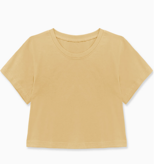 The Cutie Patootie Yellow Sporty Tee, a short-sleeve crop top in light yellow, is displayed laid flat on a white background.