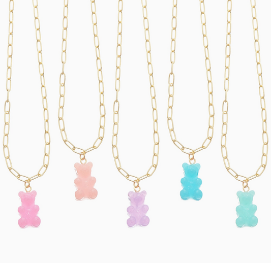 Five Lil Bear Thang Paperclip Necklaces by top trenz inc., each with a different colored gummy bear charm—pink, peach, purple, blue, and green—are arranged in a row on a white background.