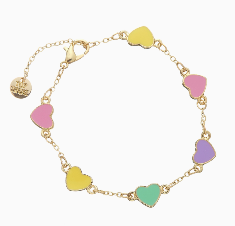 The Charm After Charm Bracelet by top trenz inc. features a gold chain with pastel enamel heart charms in yellow, pink, green, and purple. It includes an adjustable lobster clasp and a small round gold tag.