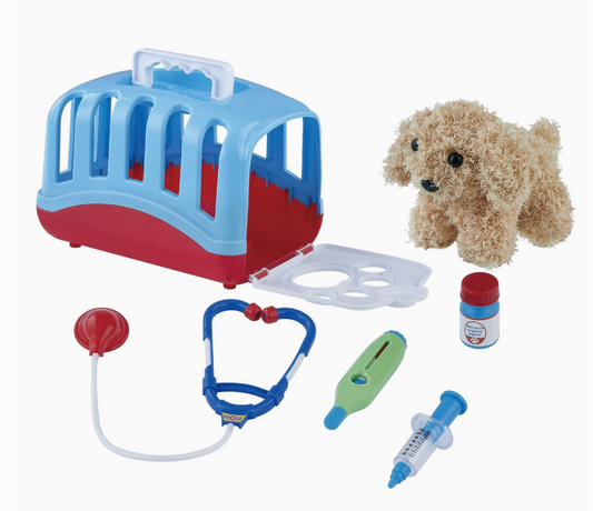The Toy Smith Puppy Vet Toy Set includes a plush dog, blue/red pet carrier, stethoscope, thermometer, syringe, medicine bottle, and red otoscope—all shown on a white background.