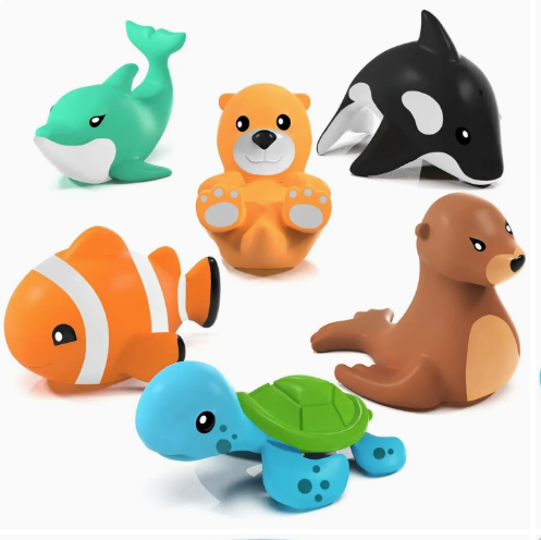 The TubWorks Tub Works® Marine™ Mold Free Bath Toys 6 Pack features a green whale, two otters (orange and brown), a black-and-white orca, an orange clownfish, and a blue turtle with a green shell on a white background.