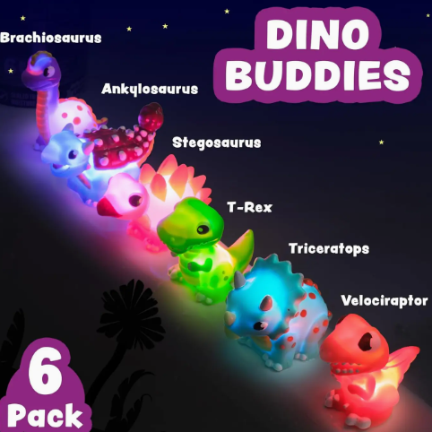 Six glowing TubWorks Dinos™ Light Up Bath Toys are lined up in the dark, each labeled: Brachiosaurus, Ankylosaurus, Stegosaurus, T-Rex, Triceratops, and Velociraptor. Text reads Tub Works® Dinos™ 6 Pack.