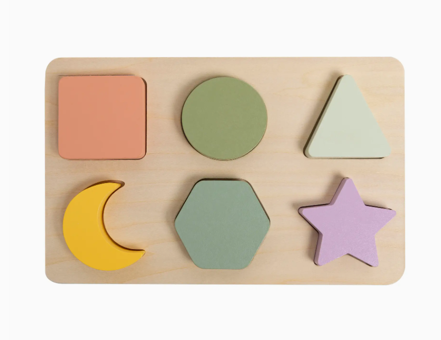 The PearHead Wooden Shapes Puzzle is a board featuring six colorful shapes—square, circle, triangle, crescent, hexagon, and star—that fit into their matching slots.