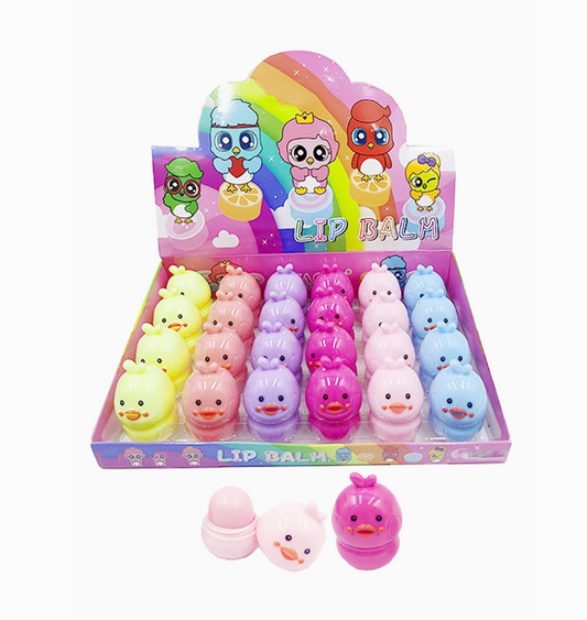 Capzone’s Baby Chick Bird Soft Touch Lip Balm comes in a display box with rows of yellow, pink, purple, and blue chick-shaped balms. The playful packaging features cartoon characters and a rainbow background.