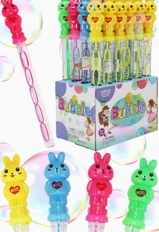 Capzone Bunny Bubble Stick Wands with bunny-shaped tops in yellow, pink, blue, and green are displayed above a box labeled "Bubble," with large bubbles floating in the background.