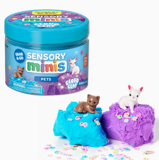 A Creativity For Kids Sensory Mini Play Kit Jar: Pets Theme features two small animal figures—one brown, one white—sitting on blue and purple cloud clay, surrounded by colorful confetti.