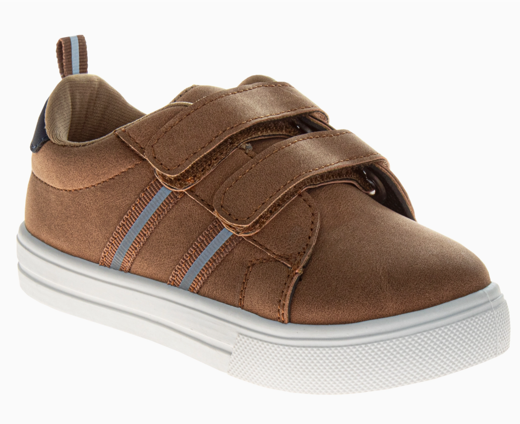 The Rustic Trail Sneakers by Josmo Shoes Inc are brown kids' sneakers with a white rubber sole, two velcro straps, blue and white side stripes, and a pull tab on the heel.
