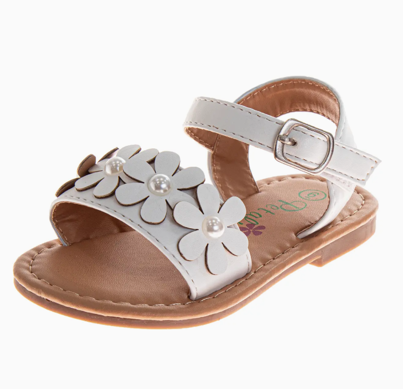 The Pearl Petal Sandals by Josmo Shoes Inc are white toddler sandals with a buckle strap, daisy-shaped flower details with pearl-like centers on the front strap, and a tan sole.