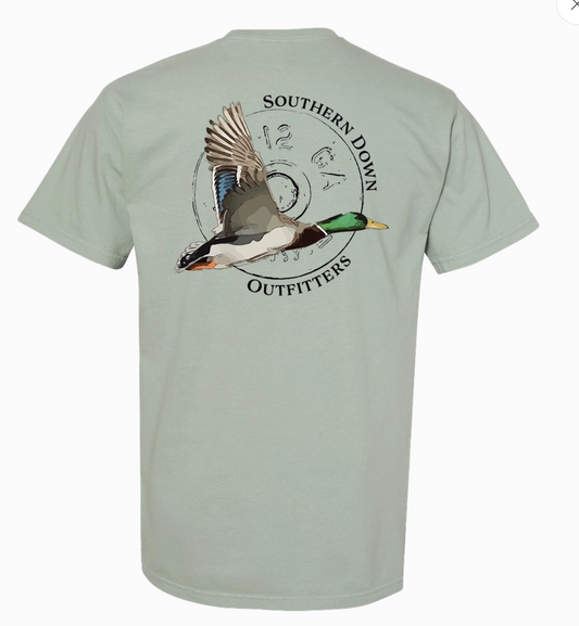 The Flying Mallard Men Tee by Wild Trail Outfitters features a light gray-green color with a flying mallard duck and "Wild Trail Outfitters" printed in a circular design on the back.