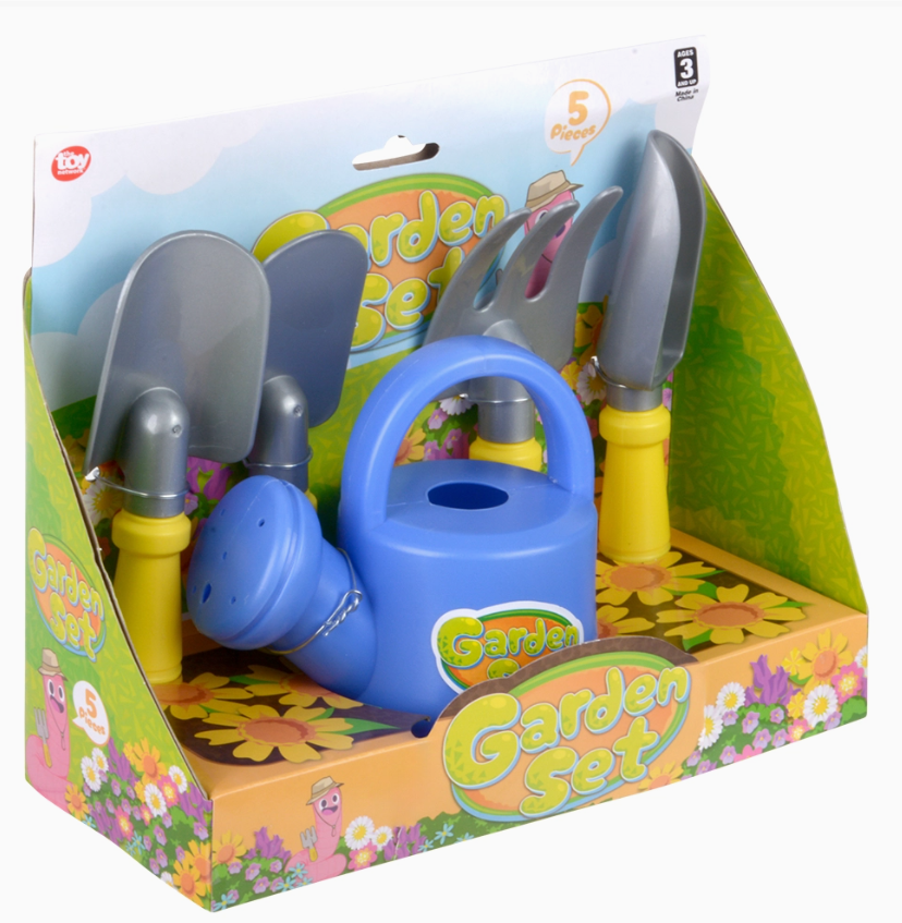 The Toy Network’s Little Gardener Play Set comes in flower-decorated packaging labeled “Garden Set” and includes a blue watering can plus four yellow-handled tools: two spades, a rake, and a trowel.