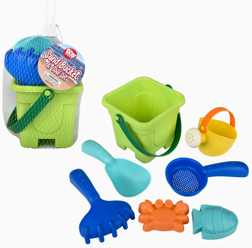 The Toy Network Sand Bucket and 6PC Tool Set includes a green plastic bucket, shovel, rake, sifter, watering can, and orange crab and blue fish molds, all shown in and outside a white mesh bag.