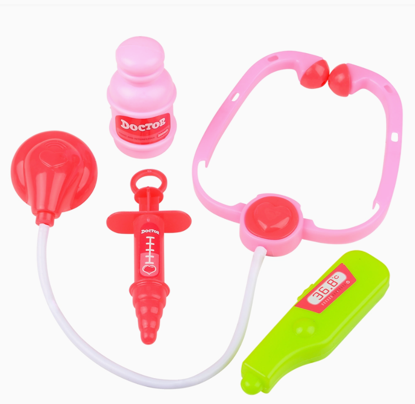 The Toy Network Safari Junior Vet Kit features colorful toy medical tools, such as a pink stethoscope, red syringe, pink medicine bottle, red reflex hammer, and green thermometer, arranged on a white background.