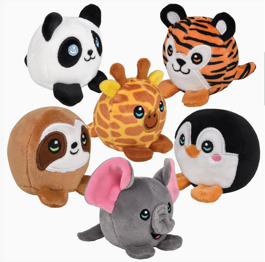 The Toy Network’s Tumble Tykes Zoo Assortment features six plush animals—a panda, tiger, giraffe, sloth, penguin, and elephant—each round with big eyes and a smiling face, displayed together against a white background.