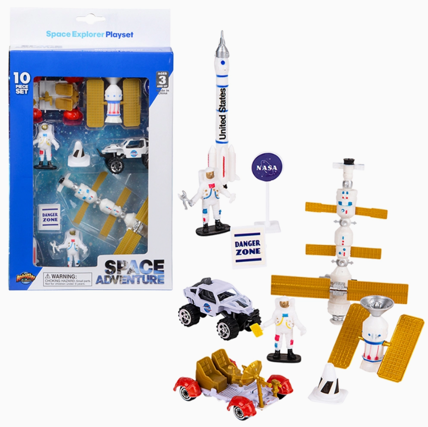 The Tiny Tot Bundles Space Explorer Box Set includes astronaut figures, vehicles, a rocket marked “United States,” NASA and Danger Zone signs, plus modular space station parts with gold solar panels, shown both in and out of packaging.