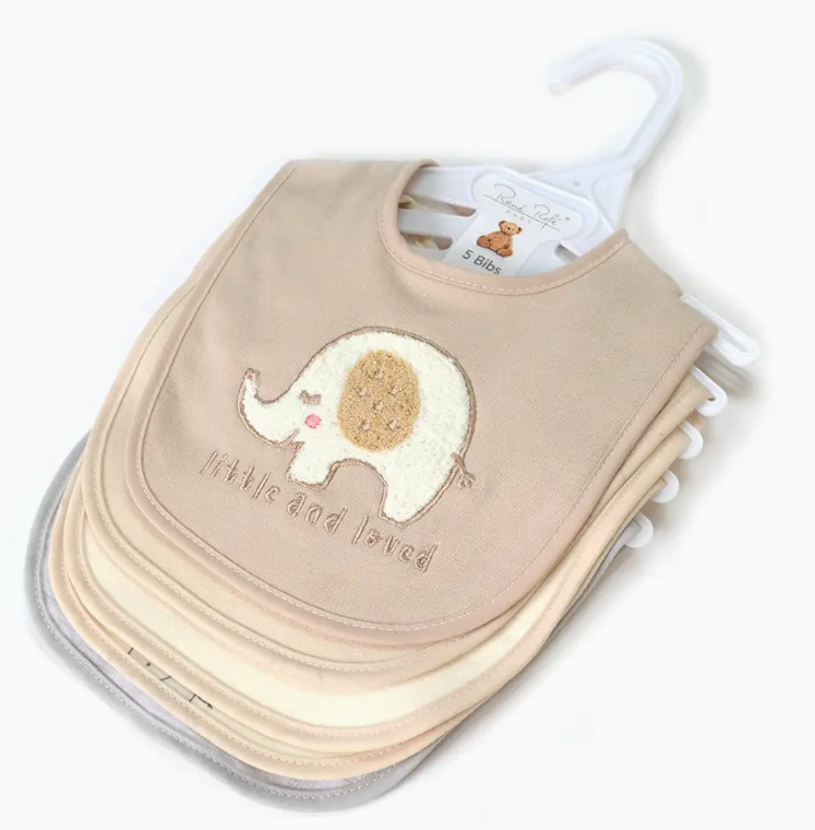 The Lollipop Dreams Little & Loved Bib Set includes five pastel baby bibs on a hanger, with the top bib showcasing an embroidered elephant and the words "little & loved.