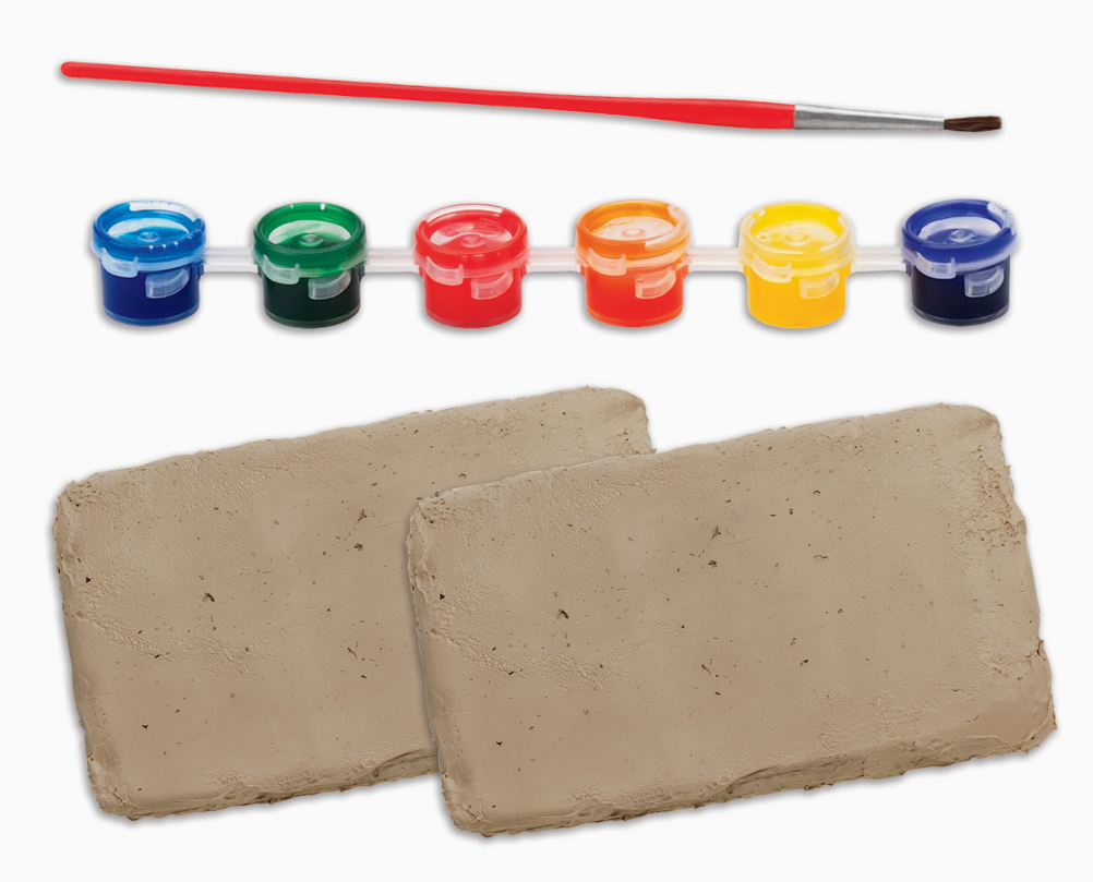 The Creativity For Kids Pottery Studio Refill Set includes a red paintbrush, five small paint pots (blue, green, yellow, orange, red), and two beige clay slabs, all arranged on a white background.