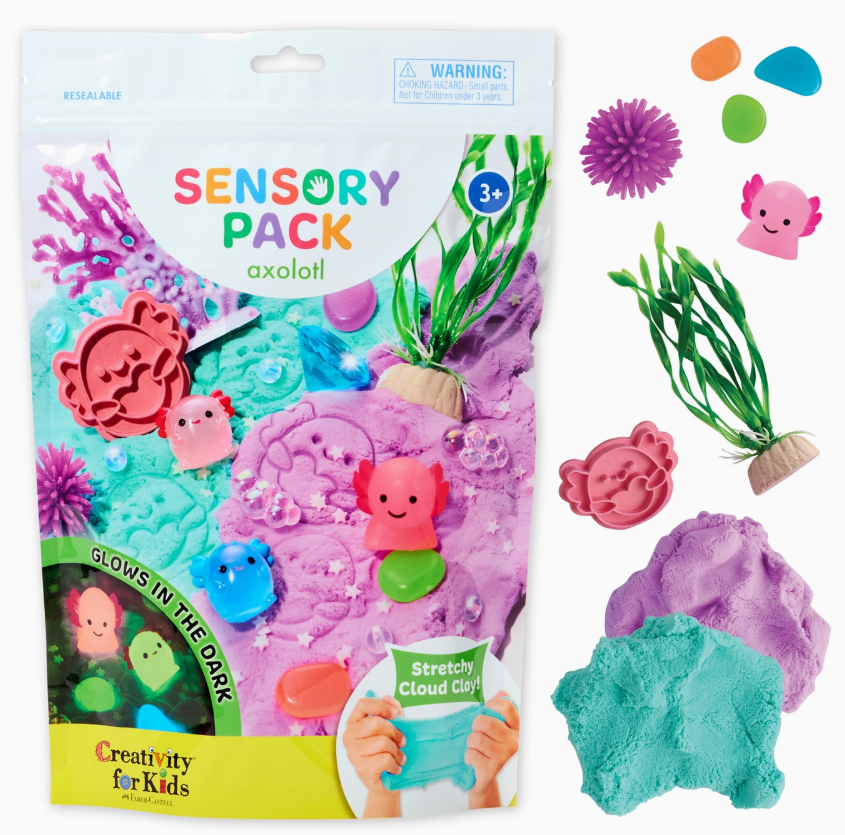 The Sensory Pack Axolotl Play Kit by Creativity For Kids features axolotl-themed items like glow-in-the-dark purple and blue cloud clay, colorful pebbles, plastic plants, a pink spiky ball, and assorted axolotl and sea creature molds.