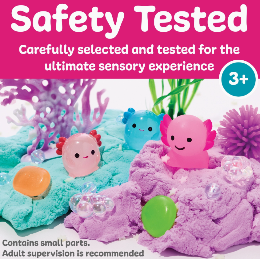 Create a vibrant sensory scene with the Sensory Pack Axolotl Play Kit by Creativity For Kids—includes pastel sand, pink and blue axolotl toys, jelly stones, and plastic coral. Safety tested for ages 3+; adult supervision recommended.