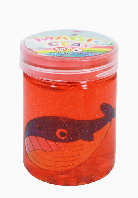 The Capzone Marine Sea Animal Slime Mini Jar is a small clear jar with red glittery slime, a cartoon whale on the front, and a colorful "Magic Clay" lid.