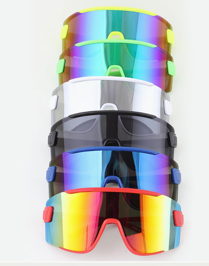 Five pairs of 3AM BY H&D ACCESSORIES Oversized Shield Sunglasses are stacked vertically, each featuring a unique frame and lens color with accents of green, white, black, blue, and red.