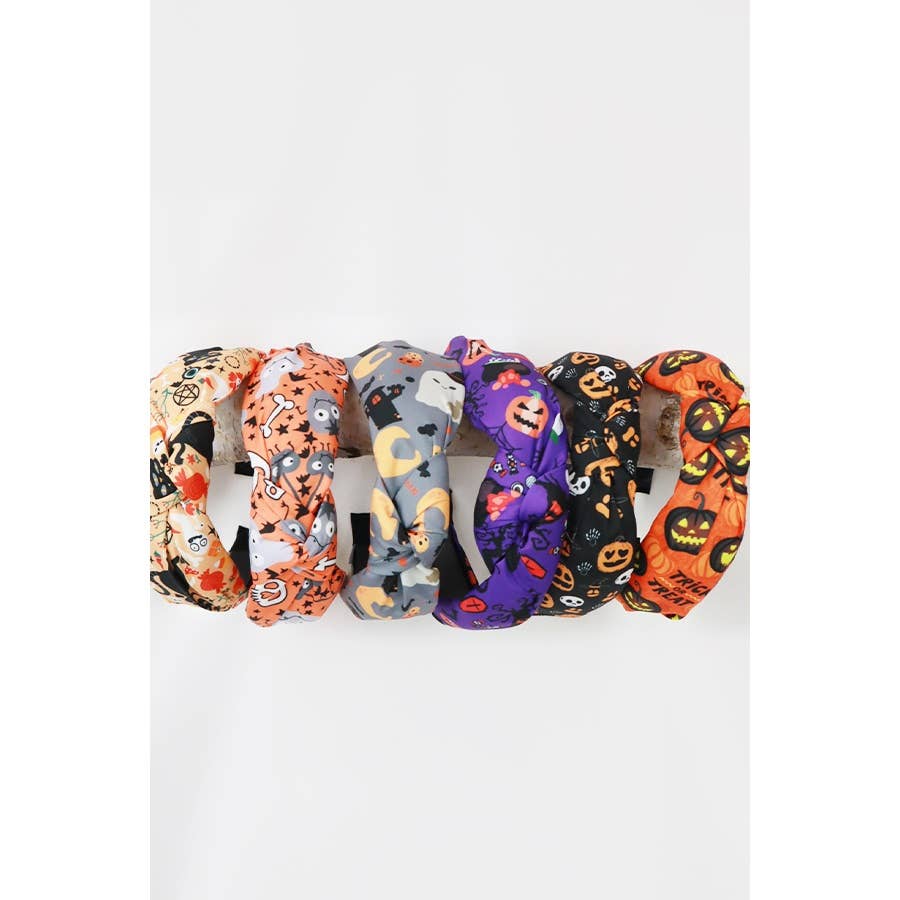 Six Love and Repeat Halloween Theme Headbands featuring various prints, including ghosts, pumpkins, and skulls.