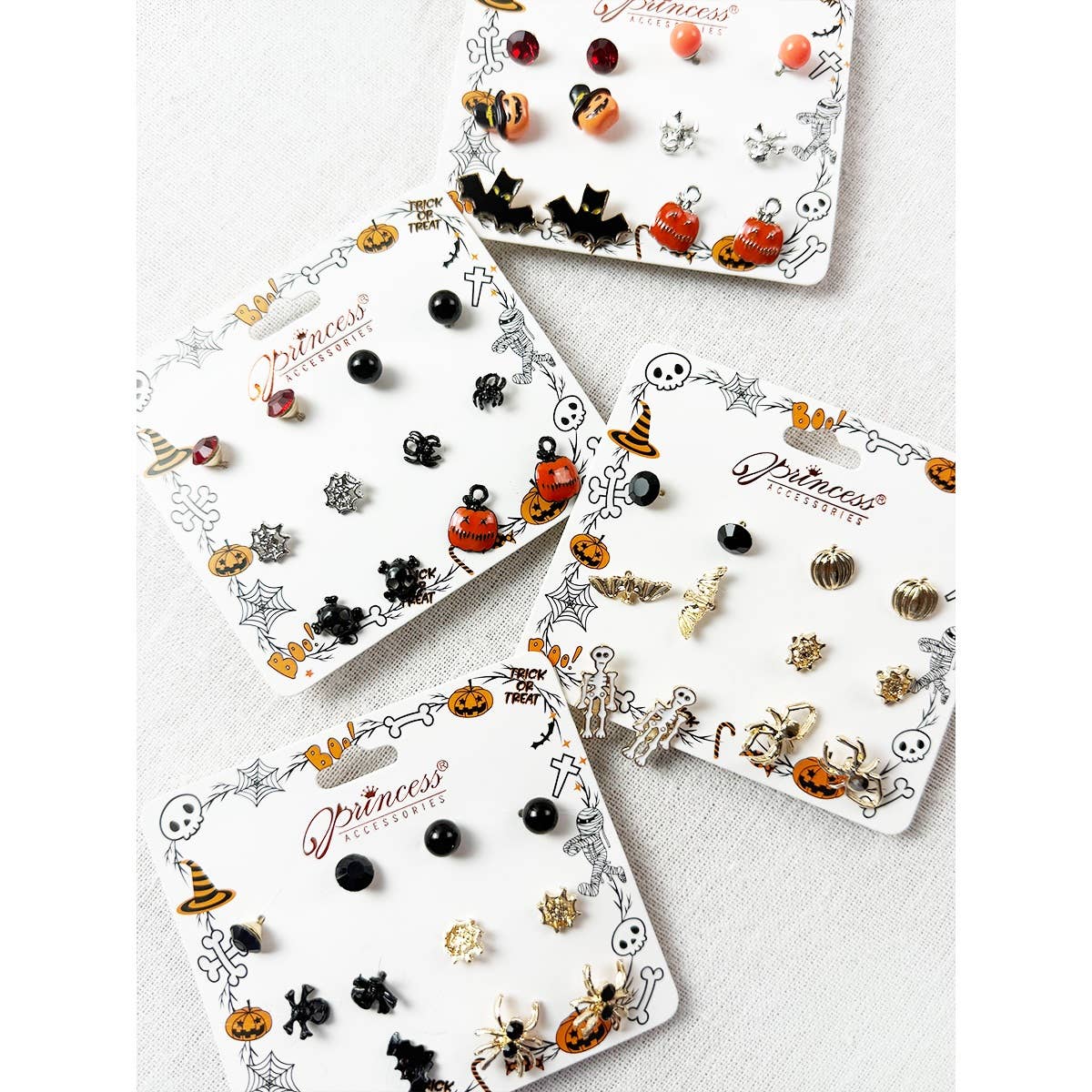 Cute Halloween Theme Earring Set by Love and Repeat displayed on four cards, featuring pumpkin, ghost, bat, skeleton, spider, and witch hat studs.