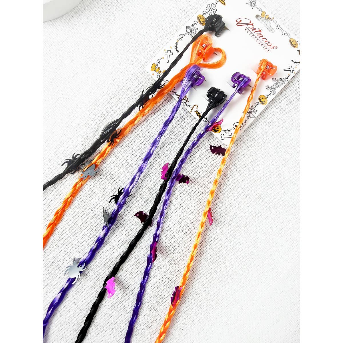 Love and Repeat Halloween Braid Hair Extension Clips consisting of five braided hair extensions with Halloween-themed charms attached to clip-in bases.