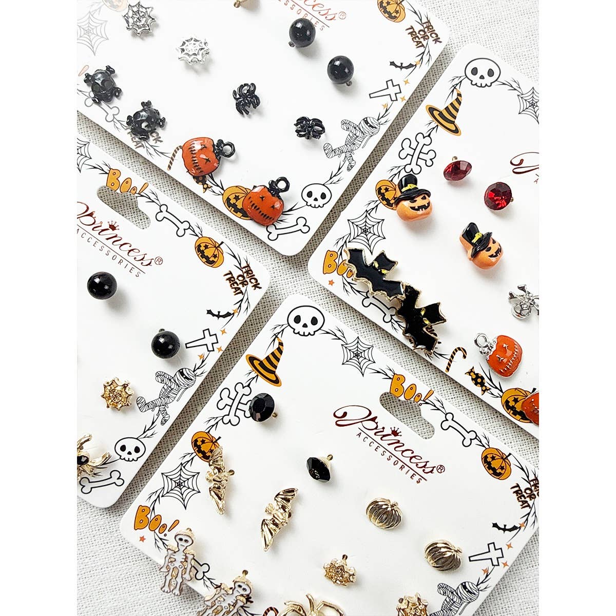 Love and Repeat Cute Halloween Theme Earring Set featuring pumpkins, ghosts, bats, skulls, and witch hats on display cards.