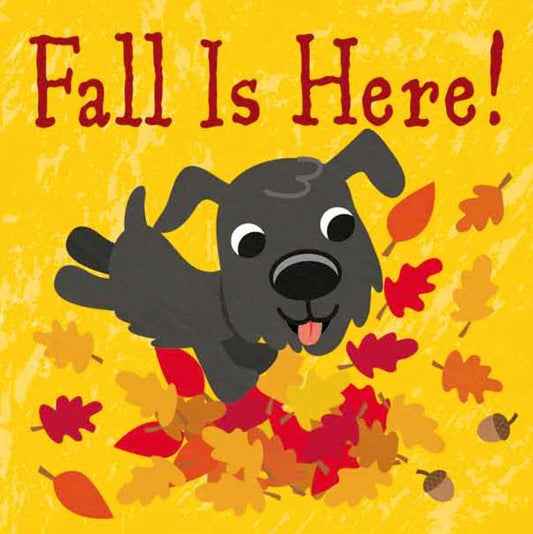 A cartoon dog leaps into a pile of colorful autumn leaves with “Fall Is Here!”—the title of the Simon & Schuster book—written above on a yellow background.