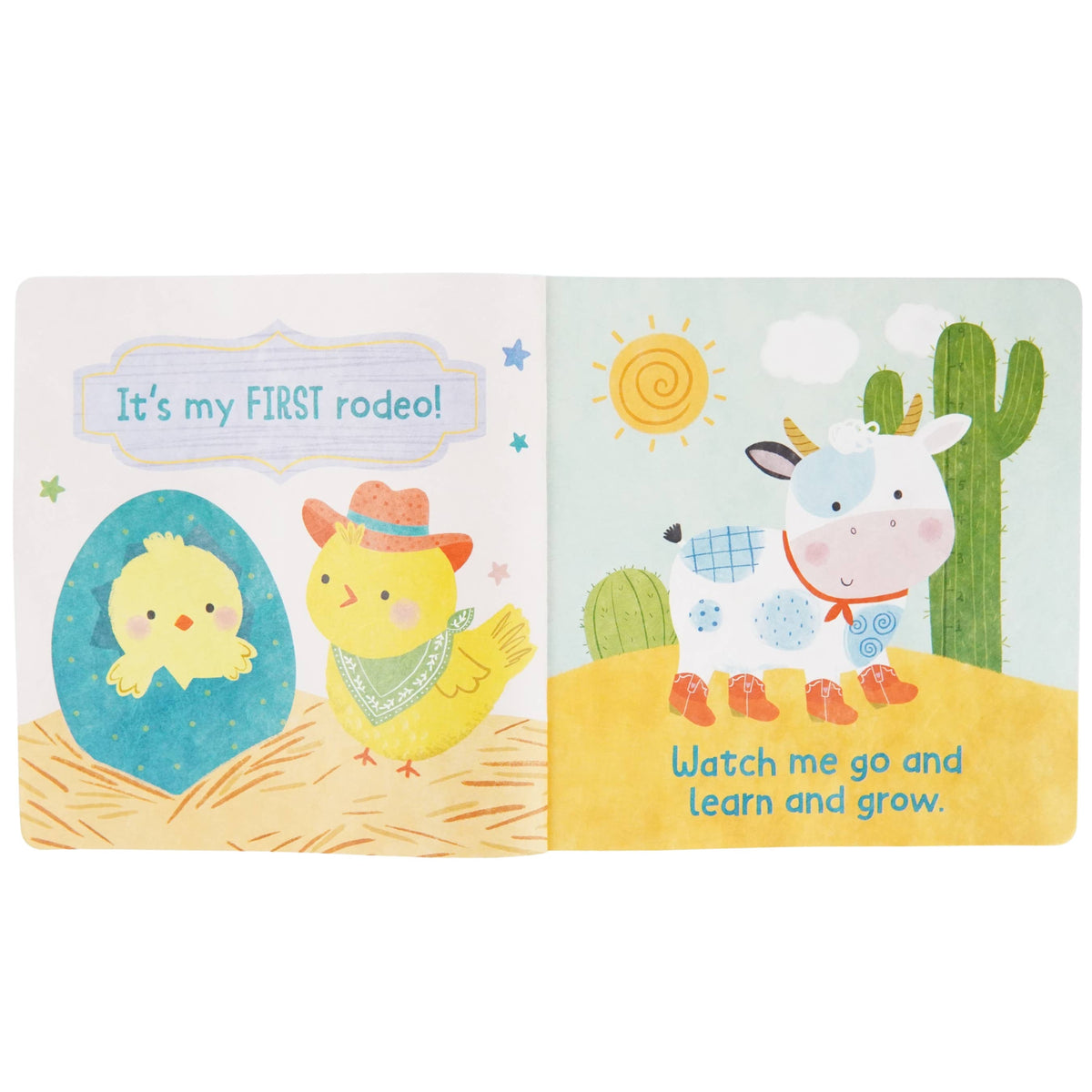 Bright and playful artwork featuring two yellow chicks—one sporting a cowboy hat and bandana—and a cow with a blue patch, all set in a desert scene with cacti and a cheerful sun, make *My First Rodeo (A Tuffy Book)* from Cottage Door Press the perfect indestructible baby book. Delight little ones as they turn the sturdy pages that proudly declare: “It’s my FIRST rodeo!” and “Watch me go and learn and grow.”.