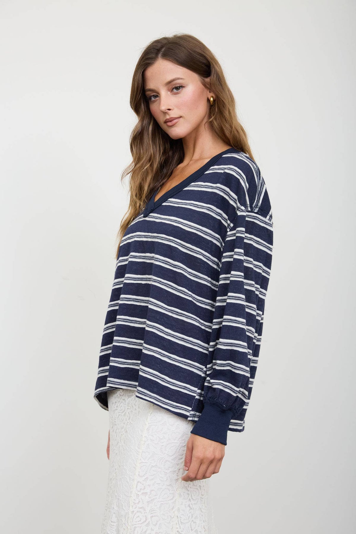 Blue Stripe V-Neck Long Sleeve top featuring blue and white horizontal stripes, a V-neck, and ribbed cuffs.
