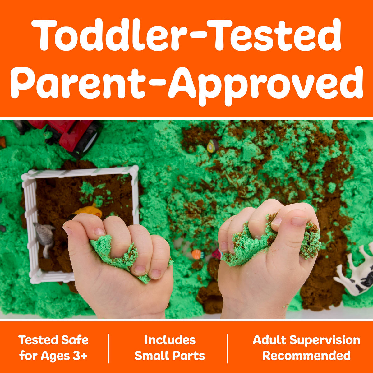 Two small hands squeeze green sensory sand above a play area filled with brown and green sand, toy fences, and animal figures—building a fun farm sensory bin that helps develop fine-motor skills. The Sensory Bin Farm Activity Kit for Kids by Faber-Castell / Creativity for Kids is toddler-tested and parent-approved, designed with safety details for ages 3+ and requires adult supervision.