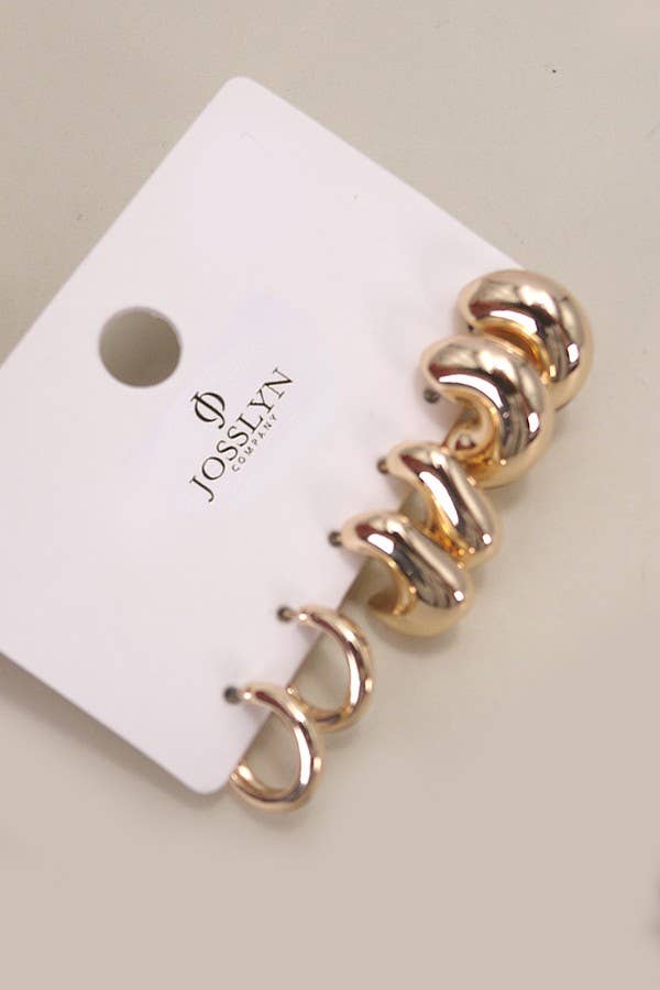 JOSSLYN by wall to wall Bubble Hoop Trio Earrings consisting of three pairs of gold-toned hoop earrings in graduated sizes displayed on a white branded card.