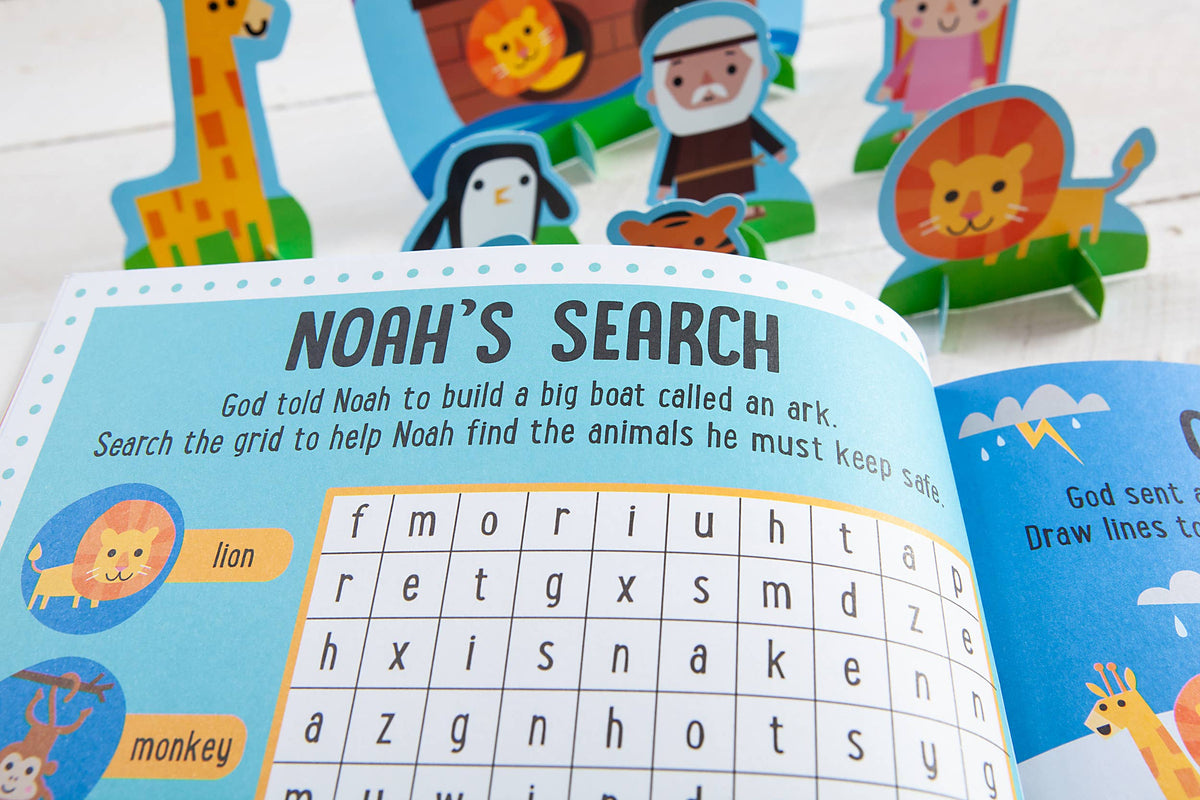 A copy of the My Bible Stories Activity Book by BroadStreet Publishing Group, LLC is open to a Noah’s Ark-themed animal word search puzzle, with colorful cut-out animal and character figures standing behind it.