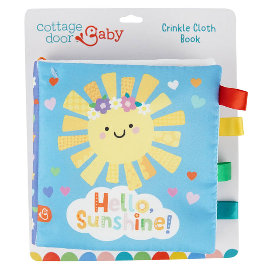 The Hello, Sunshine! Cloth Book by Cottage Door Press is a soft, crinkle baby book with a cheerful smiling sun, bright ribbons, and the words “Hello, Sunshine!” on the cover. Featuring a blue background decorated with hearts and flowers, this engaging book is perfect for little hands and helps stimulate your baby’s senses.